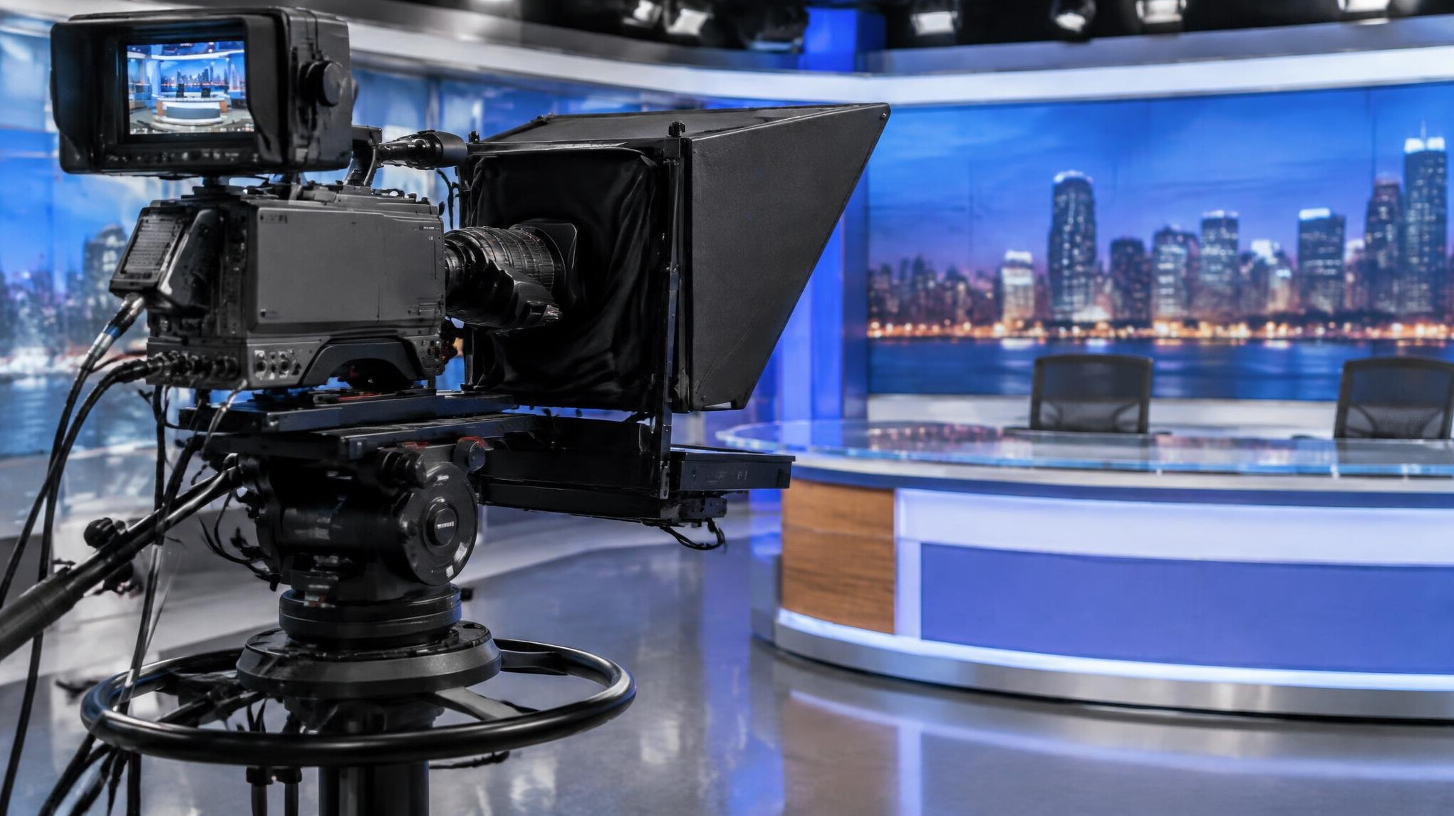 Studio pedestal camera with a teleprompter in a news studio